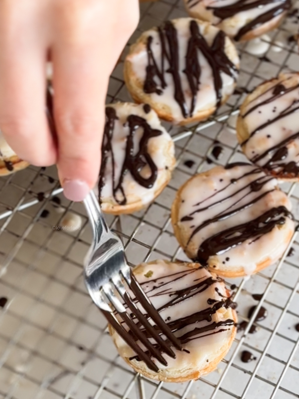 Chocolate drizzle on finished tarts